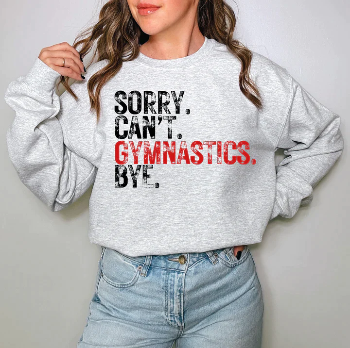 a woman wearing a sweatshirt that says sorry can't gymnastics bye